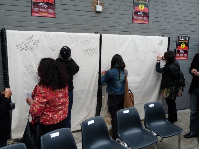 Kinchela, audience writing on banner